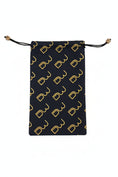 Load image into Gallery viewer, A black drawstring pouch with a repeating gold monogram pattern, laid flat on a textured gray surface.