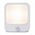 Load image into Gallery viewer, A red-tinted nightlight with a white edge and a sensor on the front.