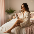 Load image into Gallery viewer, Woman applying Deep Rest Magnesium Spray to legs