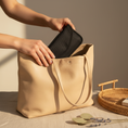 Load image into Gallery viewer, Woman placing DreamSafe in purse, Anthropologie aesthetic