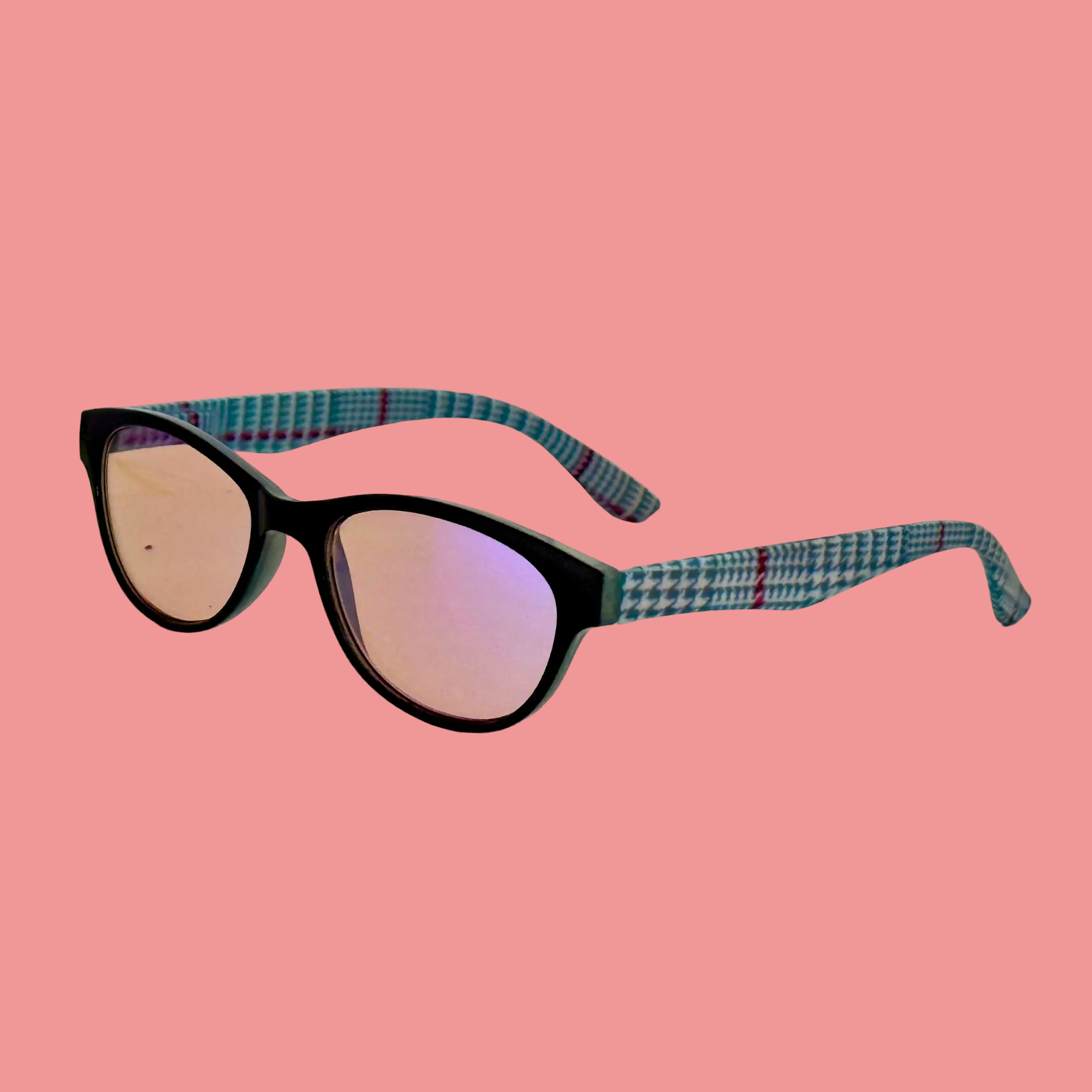 Sunglasses with black frame and pink lenses on a white background