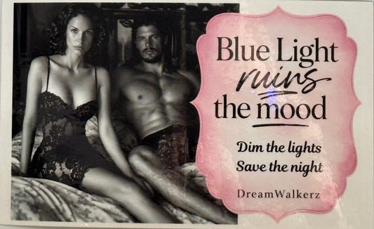 Promotional Sticker with a couple in bed and text 'Blue Light Ruins the Mood' by DreamWalkerz.
