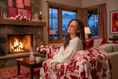 Load image into Gallery viewer, Chalet Evening Sweater ShotWoman wearing Rose Quartz Sleep Glasses in nighttime mountain chalet
