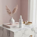 Load image into Gallery viewer, Deep Rest Magnesium Spray on magazine-worthy marble nightstand
