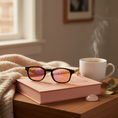 Load image into Gallery viewer, Glasses on book with tea
